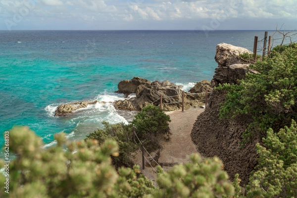 Fototapeta The coastline of the Caribbean Sea with white sand and rocks