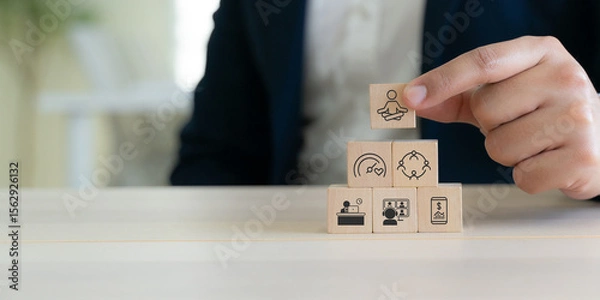 Obraz Digital wellbeing in workplace concept. Wooden blocks with icons representing digital wellbeing, healthy work-life balance. Promoting a healthy relationship with technology, encouraging mindful usage.