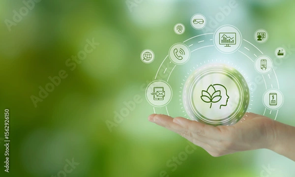 Obraz Digital Wellbeing and Detox Concep. Holding a glowing digital interface with icons representing mental wellness on green background. Balance between staying connected and practicing digital detox.