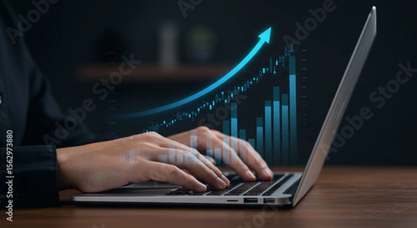 Fototapeta Close-up of hands typing on a laptop keyboard, representing business and technology in the office