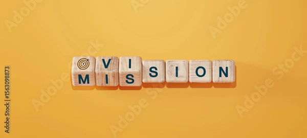 Fototapeta Wooden cubes with words "Vision" and "Mission" arranged on orange background with target icon. Concept of business strategy, goal setting, leadership, and corporate planning.