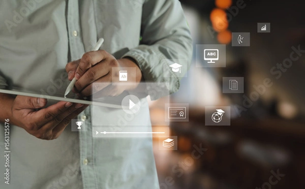 Obraz Educational video person using digital tablet with educational and learning icons floating around, symbolizing online education, digital learning