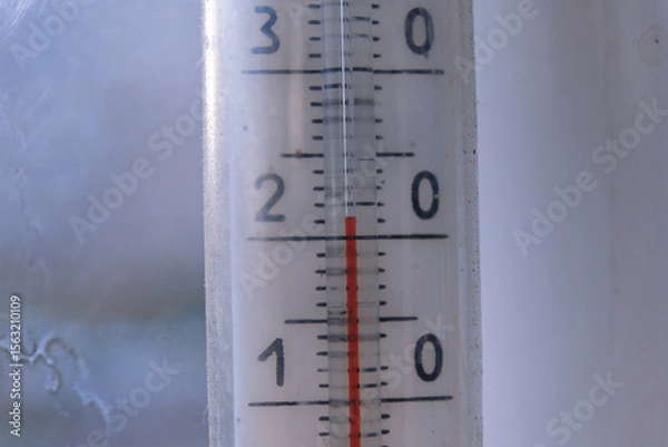 Fototapeta Macro shot of an outdoor thermometer, where the red column shows exactly 21 degrees. Concept of comfortable temperature, measurements, summer weather, climate
