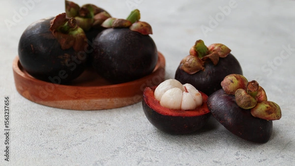 Obraz Mangosteen isolated on grey background. Clipping path.	
