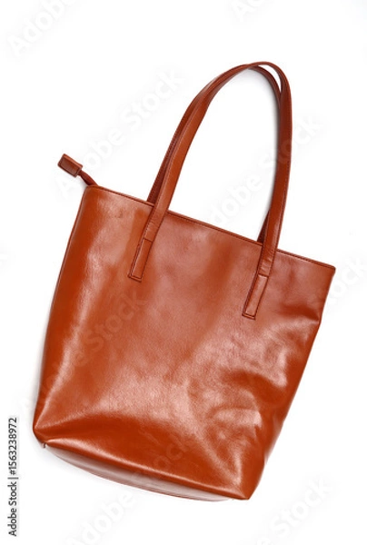 Obraz Woman's brown leather tote bag isolated on white background. Modern bag 