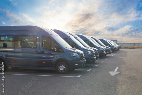 Fototapeta Series of new vans are parked in rows