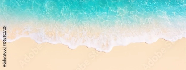 Fototapeta Beach shoreline with turquoise ocean waves washing onto yellow sand viewed from above. Aerial beach image for banner with copy space. Summer vacation and tropical paradise concept.