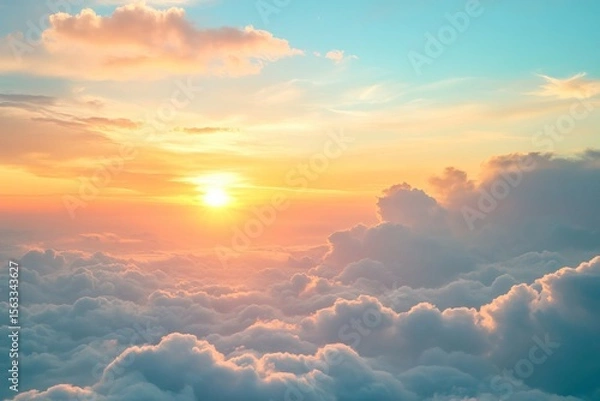 Fototapeta Dreamy sunrise above soft fluffy clouds with vibrant pastel colors in sky, peaceful tranquil atmosphere inspiring new beginnings and hope