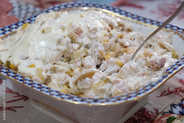 Fototapeta Festive dish with salad on a set table. Concept of family feast, celebration, joyful dinner, party