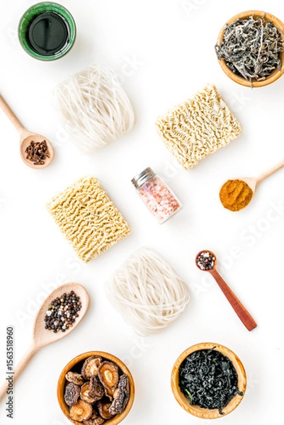 Obraz Chinese and Japanese food cooking with mushrooms, spices and noodles on white background top view geometric pattern