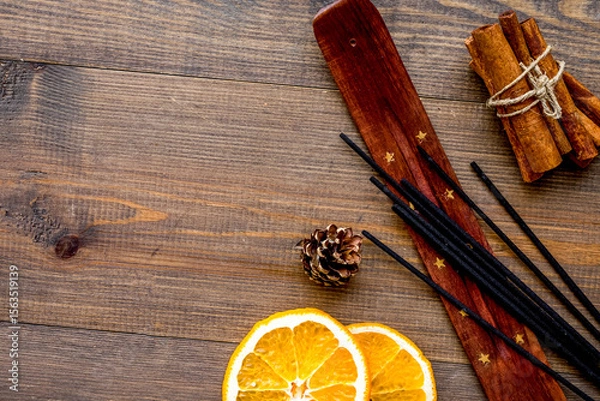 Obraz citrus and cinnamon fragrance diffuser for air freshness on wooden background top view mock-up