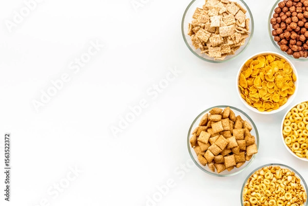 Obraz cereals, oatflakes and cornflakes for healthy breakfast on white background top view mock up