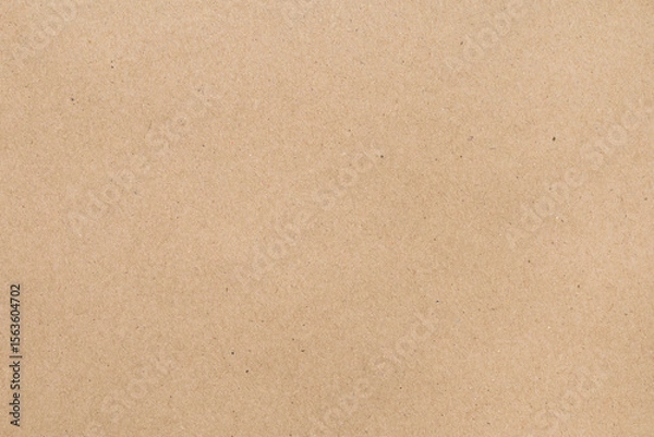 Fototapeta Full frame plain brown kraft paper texture background, ideal for packaging, eco-friendly themes, or rustic designs.