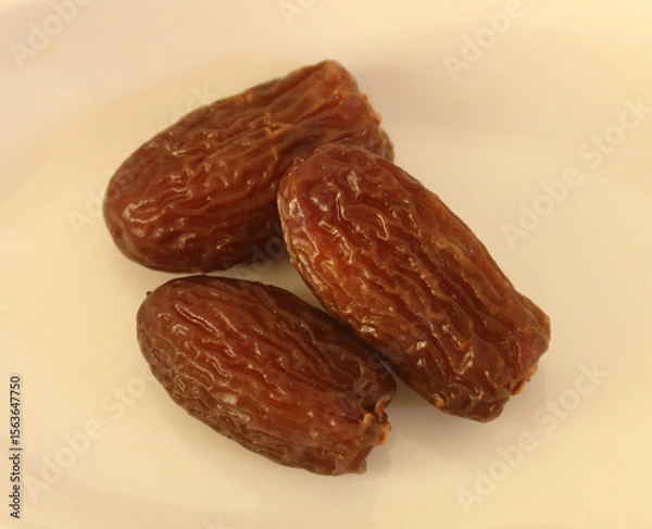Fototapeta Dried dates isolated on white background