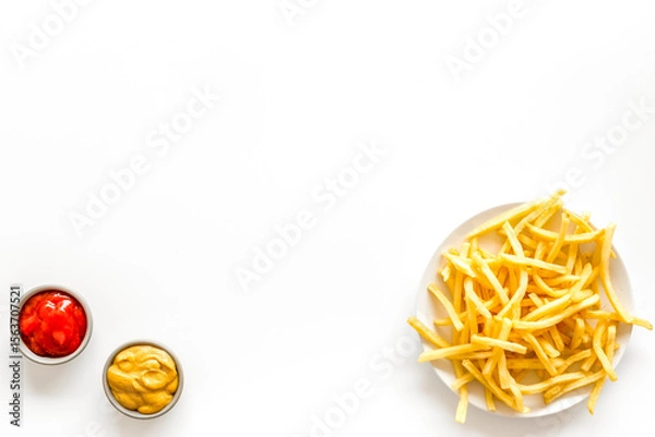 Obraz Fast food symbol. French fries on plate on white table top-down copy space