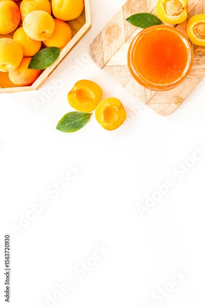 Obraz Summer preserves. Apricot jam in jar near fresh fruits on white background top view frame copy space