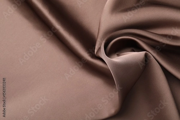 Fototapeta Crumpled light brown silk fabric as background, top view