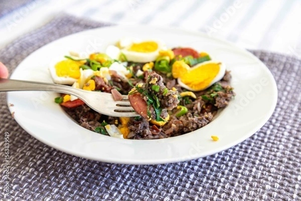 Fototapeta Traditional black bean tutu with kale, calabrese sausage, bacon and egg. A classic rustic dish from Minas Gerais