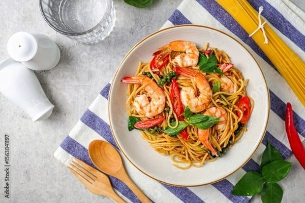 Obraz Stir Fried Spicy Spaghetti with shrimps in a white plate 