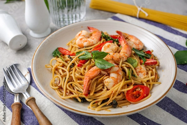 Obraz Stir Fried Spicy Spaghetti with shrimps in a white plate 