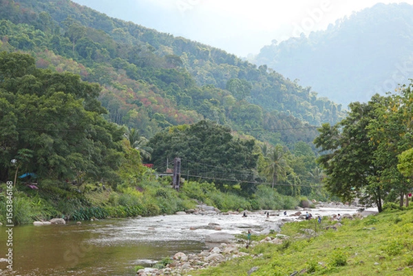 Obraz Khiri Wong village, nestled within a valley surrounded by mountains and rainforest, famous for the purest air in Thailand, Lan Saka district, Nakhon Si Thammarat