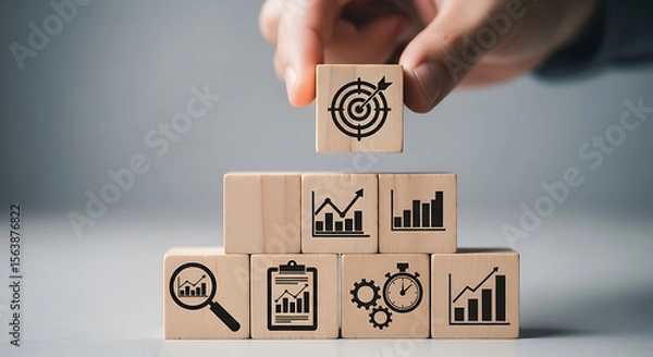 Fototapeta Wooden cubes with business growth icons target icon graph icon
