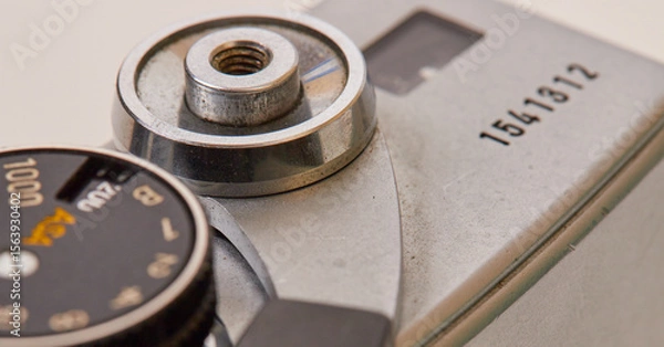 Fototapeta Macro stock photography, of an old manual 35mm SLR camera with a 50mm F/1.4 lens!
