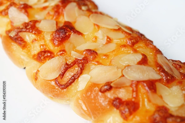 Obraz Closeup of Mouthwatering Cheesy Homemade Almond Twist Bread