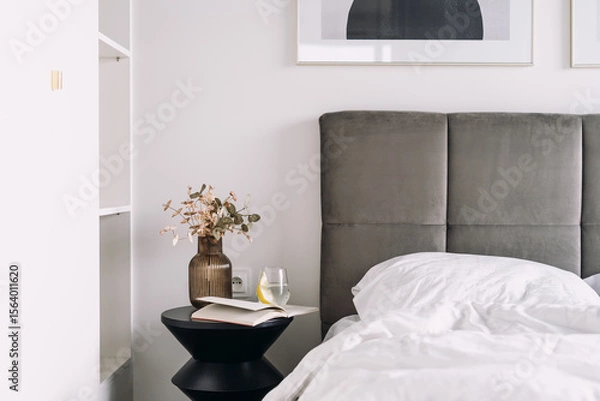 Obraz Bright and cozy hotel suite featuring a comfortable bed in the morning light