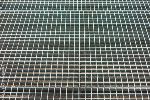 Obraz Metal grating surface with squares arranged in a pattern and detail of metallic texture