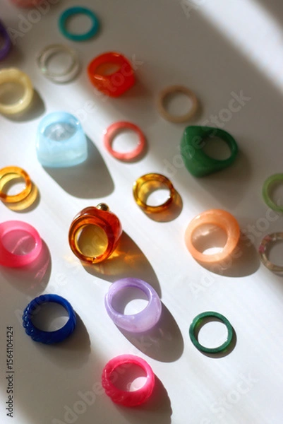 Obraz Collection of colorful plastic rings on white background. Selective focus.