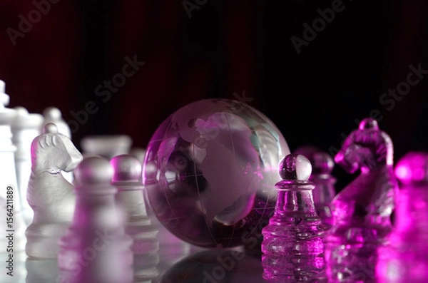 Fototapeta Crystal planet Earth amidst chess pieces showing the American continent, representing concepts of geopolitics, global power, competition for control, international relations, world leaders, struggle f
