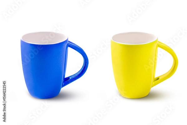Obraz Two cups of blue and yellow coffee isolated on white