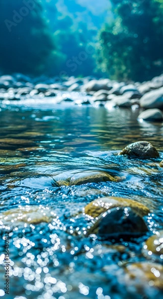 Fototapeta Serene river flows gently over smooth rocks, a soothing nature scene with sparkling water and lush greenery in the background.