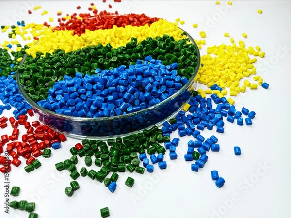 Fototapeta various colors of masterbatch granules in glass containers, polymer carrying resin and pigments poured in white background, suitable for product catalog design of industrial plastic company profile