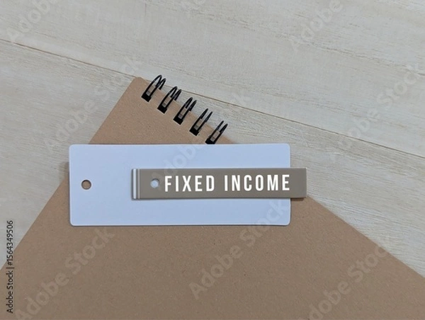 Obraz Fixed Income Concept with Tag on Notebook