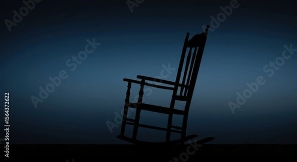Fototapeta A solitary rocking chair silhouetted against a gradient blue background, evoking tranquility and nostalgia