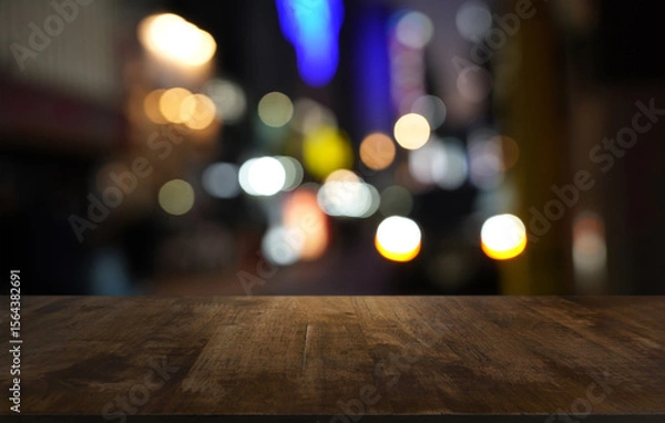 Fototapeta Empty wood table top and blur of restaurant background selective focus product display