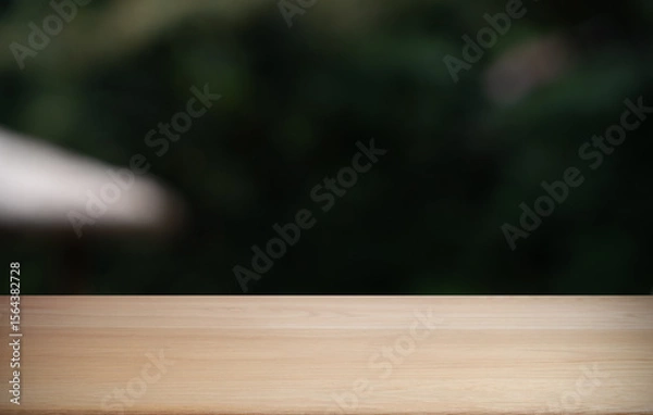 Fototapeta Empty wood table top and blur of restaurant background selective focus product display
