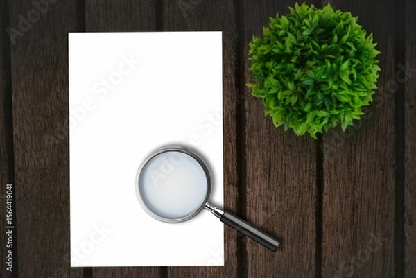 Obraz Magnifying glass on paper