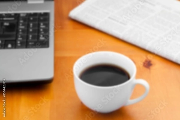 Obraz Coffee cup with newspaper on desk in office