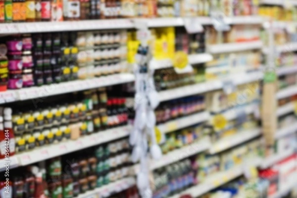 Fototapeta Defocused image of food in rack at store