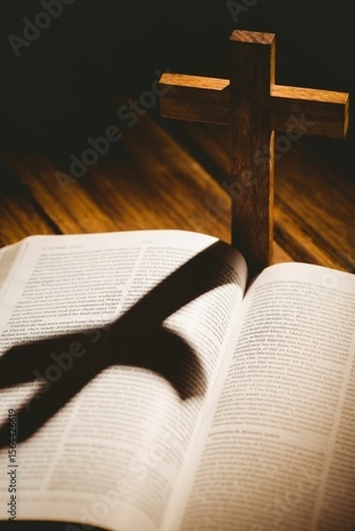 Obraz Wooden cross with shadow on bible