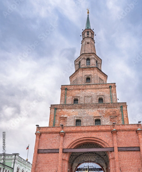 Obraz The ancient leaning red brick Syuyumbike Tower on the territory of the Kazan Kremlin. Russia