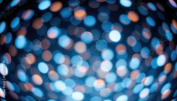 Fototapeta Abstract colorful bokeh background with blurred circles of light in blue, orange, and white hues creating a dreamy and festive atmosphere for visuals
