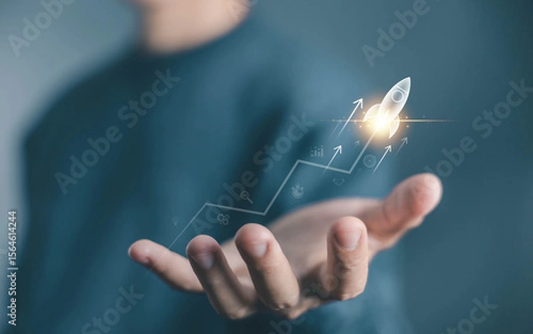 Fototapeta businessman launch rocket, startup concept. entrepreneurship starts with digital technology and the growth of an online business. progress of Leadership and new business success
