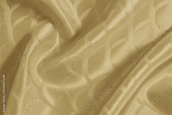 Fototapeta Smooth, elegant golden silk fabric with a flowing, shiny texture creates a luxurious backdrop