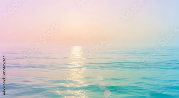 Fototapeta Soft pastel hues wash across the serene seascape at sunrise, creating a calming, dreamy atmosphere over the gentle turquoise waves.