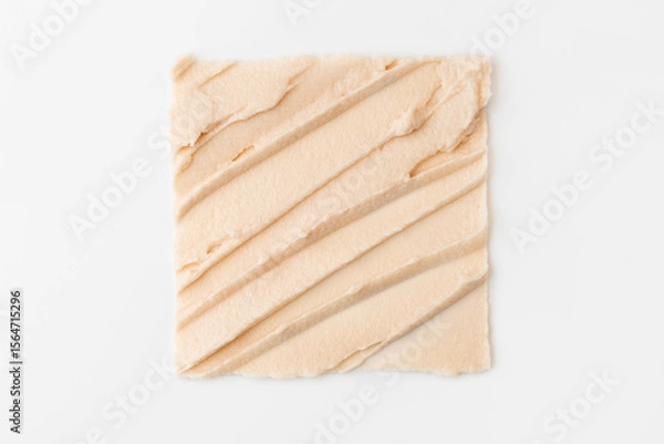 Fototapeta The texture of cosmetic cream in the form of a square on a white background