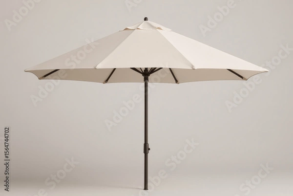 Fototapeta Large beige patio umbrella open on plain background